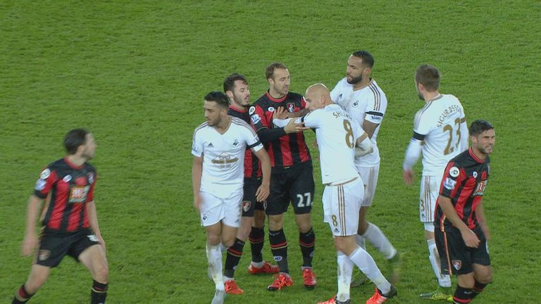 Jonjo Shelvey (r) reacts after a clash with Harry Arter.