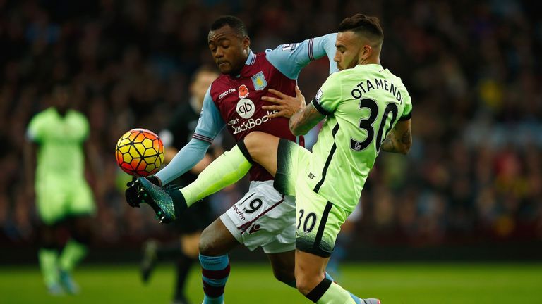 Jordan Ayew of Aston Villa and Nicolas Otamendi of Manchester City battle for the ball