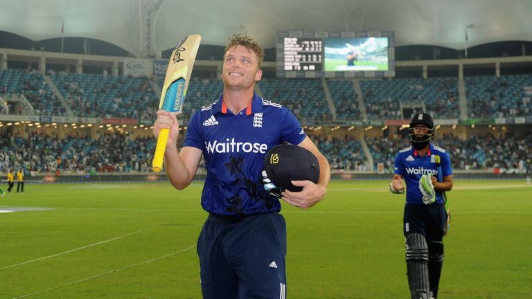 Jos Buttler of England raises his bat as he leaves the field after making 116 not out during the 4th One Day International v Pakistan