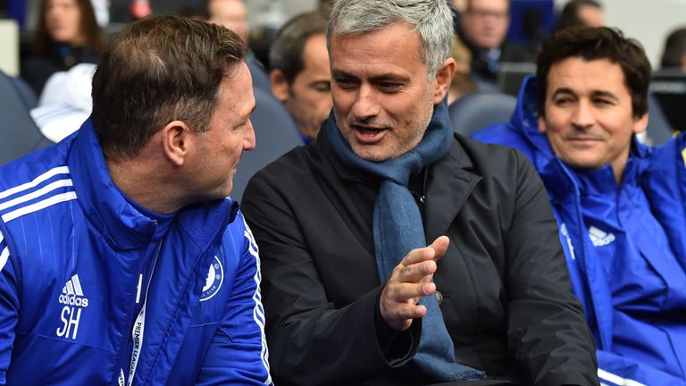 Jose Mourinho talks to his staff before kick-off at White Hart Lane