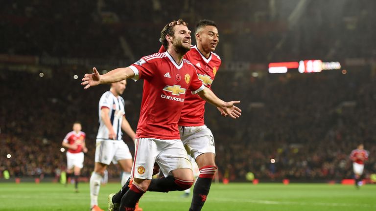 Manchester United's Juan Mata celebrates scoring their second goal against West Brom from the penalty spot with team-mate Jesse Lingard (right)
