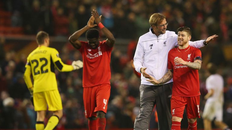 Jurgen Klopp manager of Liverpool embraces Alberto Moreno of Liverpool after victory in the UEFA Europa League