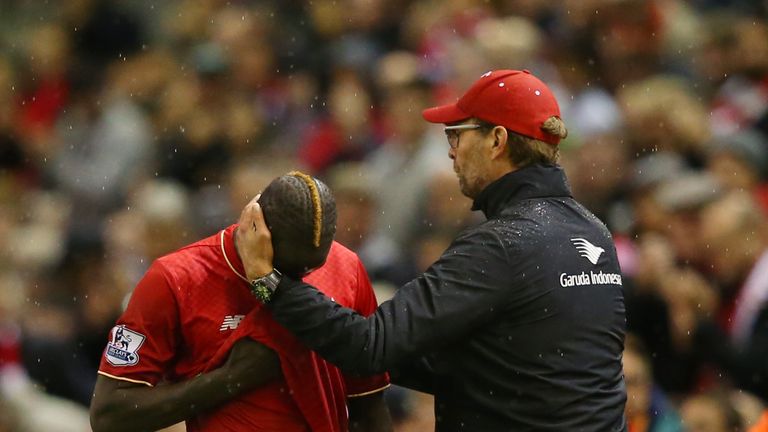 Jurgen Klopp consoles Mamadou Sakho following his injury against Crystal Palace