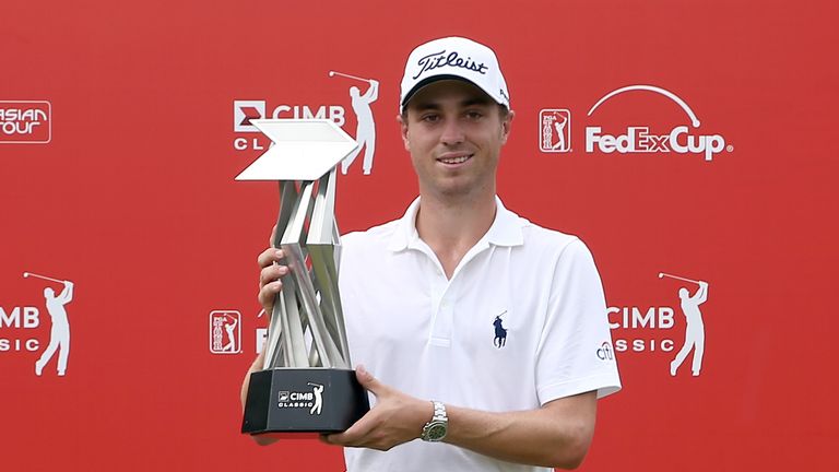 KUALA LUMPUR, MALAYSIA - NOVEMBER 01:  Justin Thomas of the United States poses with the CIMB Classic Trophy after he won it by 26 under 262 during round f