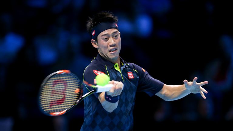 Kei Nishikori plays a forehand in his men's singles match against Tomas Berdych during day three of the Barclays ATP World Tour Finals at the O2 Arena