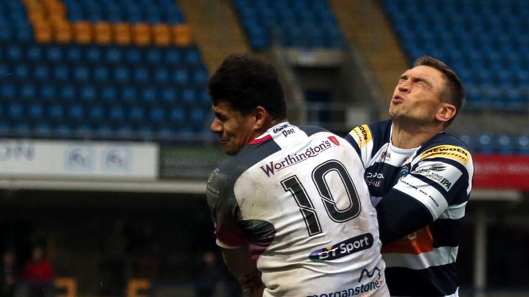 Kevin Sinfield (R) of Yorkshire Carnegie is challenged by Joel Matavesi of Ospreys 