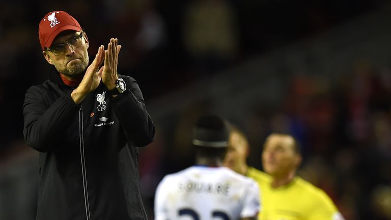 Jurgen Klopp (L) applauds the fans after losing to Palace