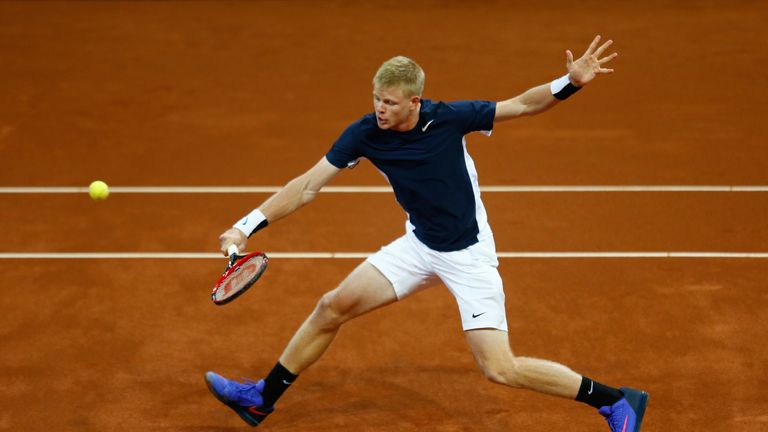Kyle Edmund of Great Britain volleys during the singles match against David Goffin of Belgium on day one of the Davis Cup Fi