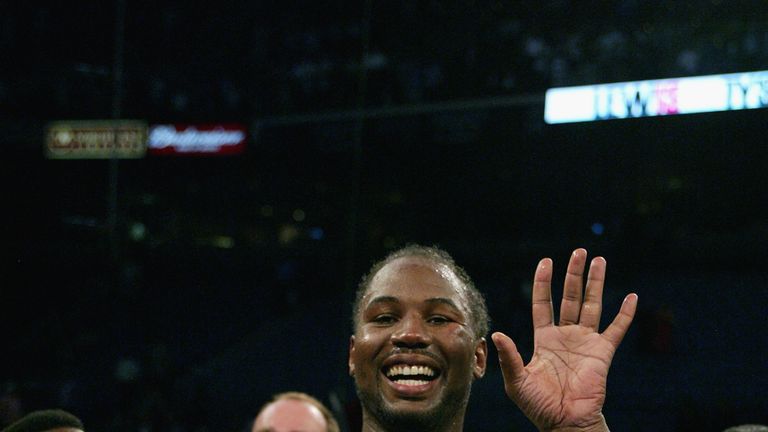 Lennox Lewis celebrates after knocking out Mike Tyson in 2002