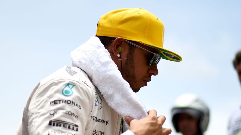 SAO PAULO, BRAZIL - NOVEMBER 15:  Lewis Hamilton of Great Britain and Mercedes GP prepares on the grid before the Formula One Grand Prix of Brazil at Autod