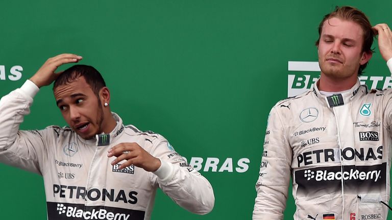 Mercedes' British Formula One driver Lewis Hamilton (L), who claimed the second place at the Brazilian Grand Prix, 