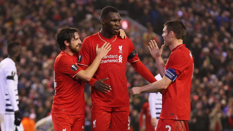 LIVERPOOL, ENGLAND - NOVEMBER 26:  Christian Benteke of Liverpool (C) celebrates with Joe Allen (L) and James Milner (R) as he scores their second goal dur