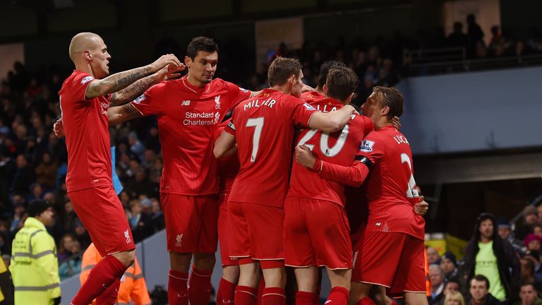 Liverpool players celebrate their team's first goal 