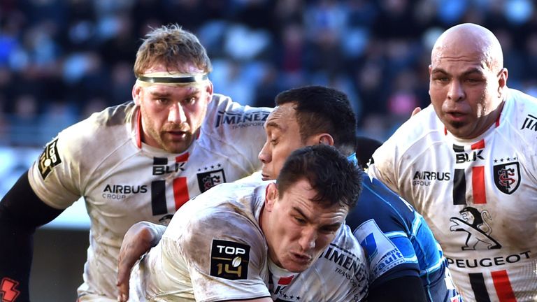 Toulouse's French number eight Louis Picamoles (C) runs with the ball during the French Top 14 rugby union match against  Montpellier 