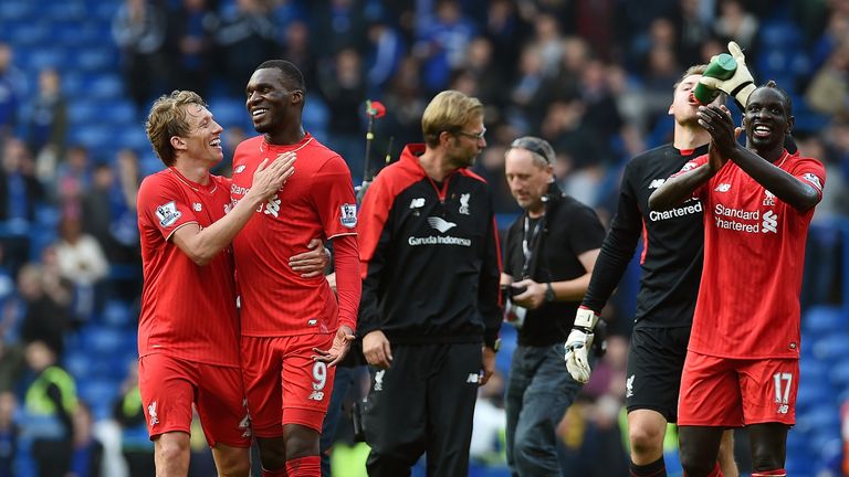 Lucas (far left) celebrates Chelsea's 3-1 win at Liverpool on Saturday