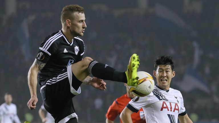 Maksim Medvedev of Qarabag FK challenged by Son Heung-min of Tottenham Hotspur FC during the UEFA Europe League match