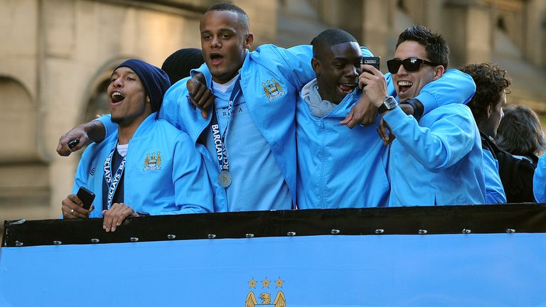 Manchester City players Nigel de Jong, Vincent Kompany, Micah Richards and Samir Nasri celebrate the Premier League title win in 2012
