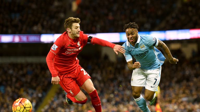Manchester City's Raheem Sterling (right) and Liverpool's Adam Lallana battle for the ball at the Etihad Stadium