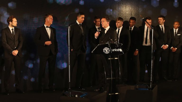 The Manchester United squad pose on stage at the United for UNICEF Gala Dinner at Old Trafford