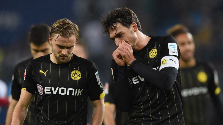 Marcel Schmeltzer and Mats Hummels of Dortmund look dejected