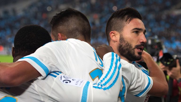 Marseille's Romain Alessandrini (R) celebrates with teammates after scoring during the match between Olympique de Marseille and AS Monaco 