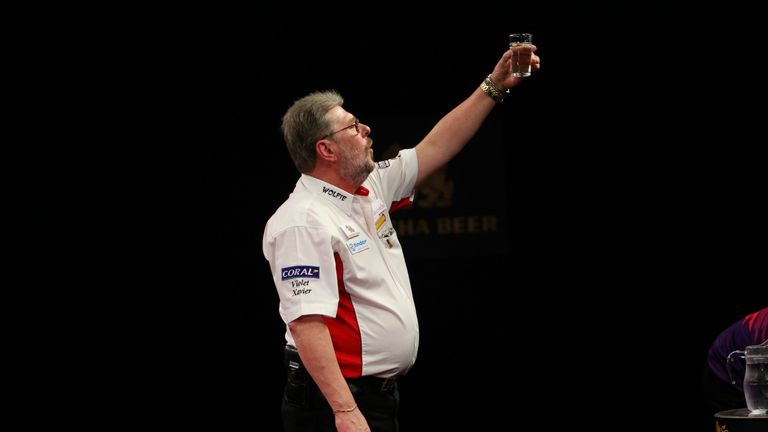 SINGHA BEER GRAND SLAM OF DARTS 2015.THE CIVIC CENTRE,WOLVERHAMPTON.PIC;LAWRENCE LUSTIG.ROUND2.MARTIN ADAMS V KIM HUYBRECHTS.MARTIN ADAMS IN ACTION