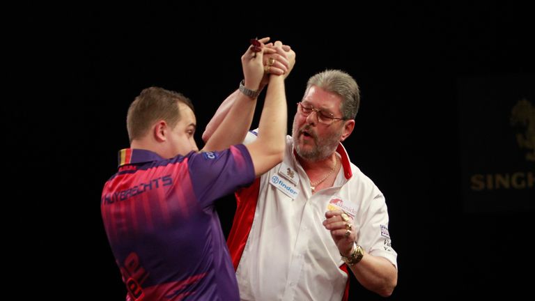 SINGHA BEER GRAND SLAM OF DARTS 2015.THE CIVIC CENTRE,WOLVERHAMPTON.PIC;LAWRENCE LUSTIG.ROUND2.MARTIN ADAMS V KIM HUYBRECHTS.MARTIN ADAMS IN ACTION