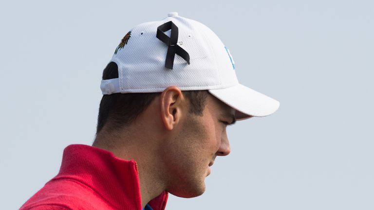 Martin Kaymer sports a black ribbon on his cap as a mark of respect