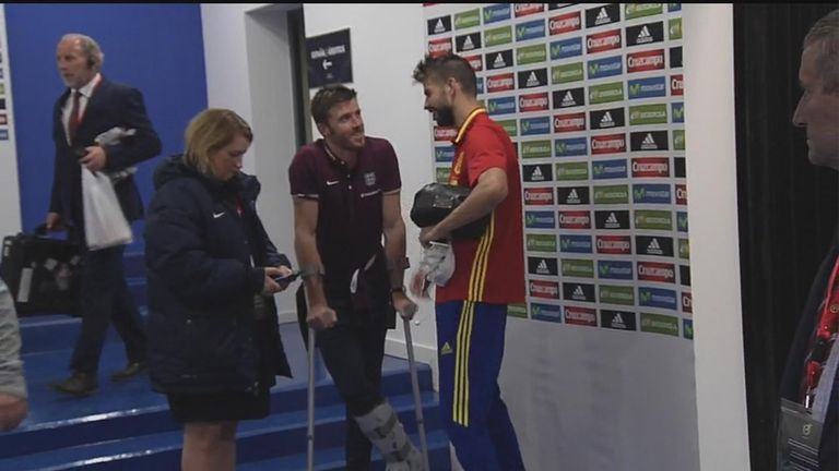 Michael Carrick (C) chats to former Manchester Untied team-mate Gerard Pique after England's defeat in Spain