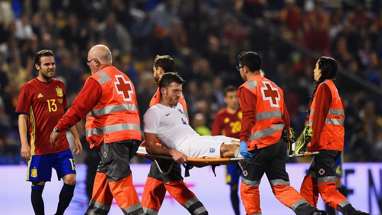 Michael Carrick is stretchered off during England's friendly against Spain in Alicante 