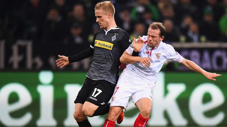Oscar Wendt of Borussia Moenchengladbach holds off Sevilla's Michael Krohn-Dehli