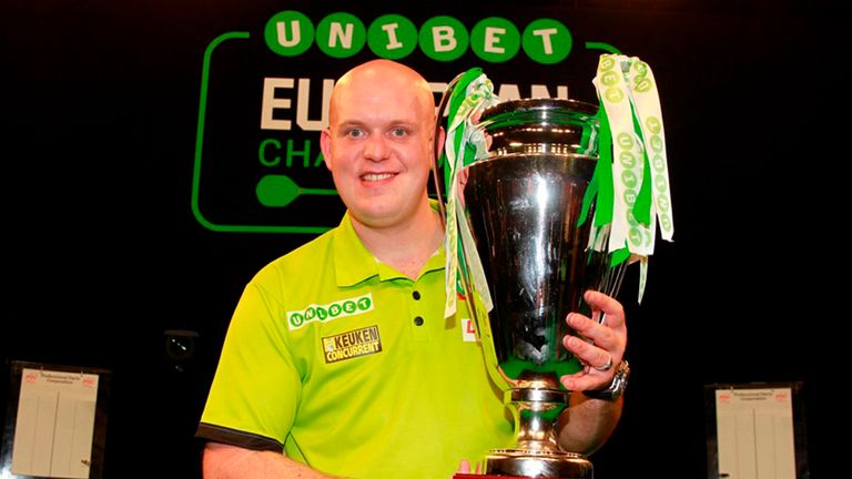 Michael van Gerwen with the European Championship trophy MUST CREDIT: Lawrence Lustig/PDC