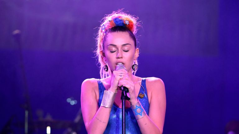 LOS ANGELES, CA - OCTOBER 17:  Musician Miley Cyrus performs onstage during Hilarity for Charity's annual variety show: James Franco's Bar Mitzvah, benefit