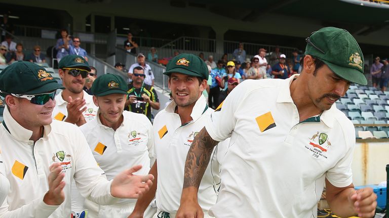 PERTH, AUSTRALIA - NOVEMBER 17:  Mitchell Johnson of Australia is acknowledged by team mates during day five of the second Test match between Australia and