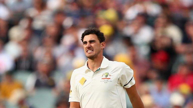 ADELAIDE, AUSTRALIA - NOVEMBER 27:  Mitchell Starc of Australia limps after bowling a delivery during day one of the Third Test match between Australia and