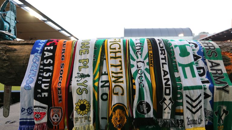 Scarfs from fans are draped over Timber Joey's log as a sign of support 