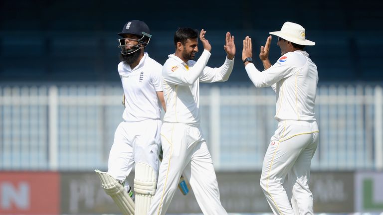 SHARJAH, UNITED ARAB EMIRATES - NOVEMBER 02: Shoaib Malik of Pakistan celebrates with Younis Khan after dismissing Moeen Ali of England during day two of t