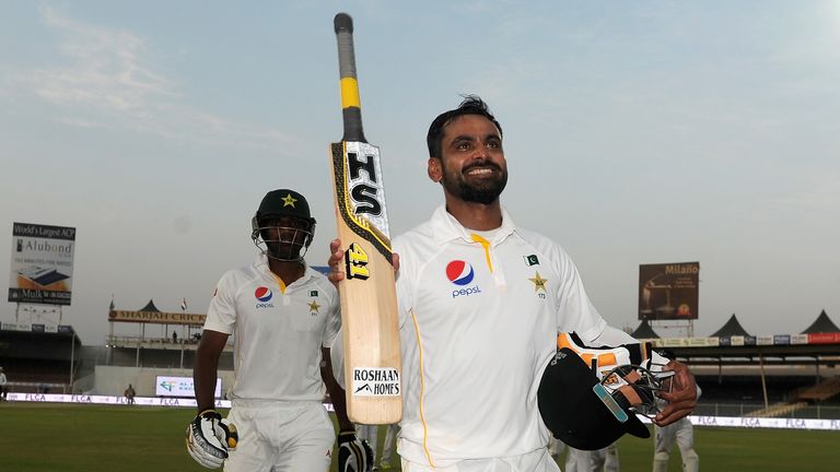 Mohammad Hafeez of Pakistan salutes the dressing room as he leaves the field at stumps on day three of the 3rd Test v England in Sharjah