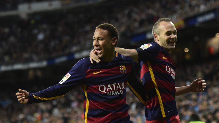Neymar (L) celebrates after Barcelona team-mate Andres Iniesta
