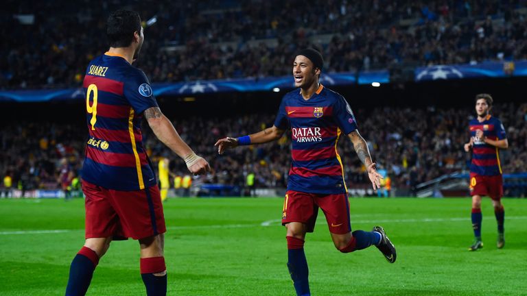 Neymar (R) of FC Barcelona celebrates with his team mate Luis Suarez after scoring his team's third goalduring the UEFA Ch