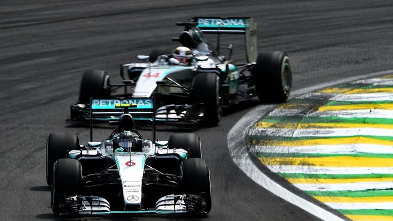 Nico Rosberg and Lewis Hamilton fight for first at Interlagos