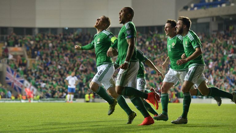 Steve Davis (L) of Northern Ireland celebrates after scoring his side's first goal against Greece during the Euro 2016 qualifier