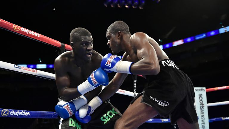 LONDON, ENGLAND - SEPTEMBER 12:  Ohara Davies forces Dame Seck against the rope in a Lightweight contest during 'Heavy Duty' fight night at The O2 Arena on