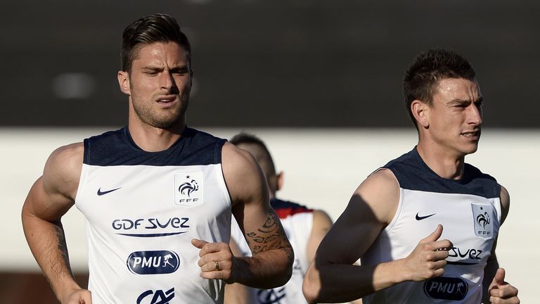 France's forward Olivier Giroud (L) and France's defender Laurent Koscielny 