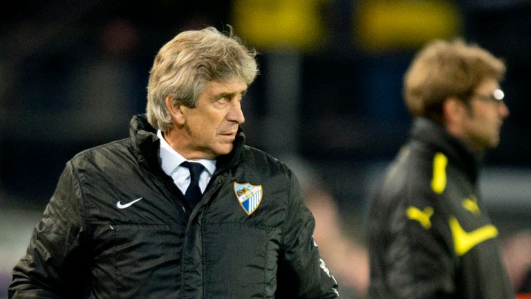 Manuel Pellegrini pictured with Jurgen Klopp in the background