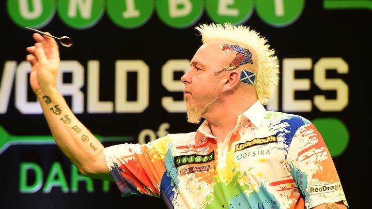 Peter Wright in action against Michael Van Gerwen.