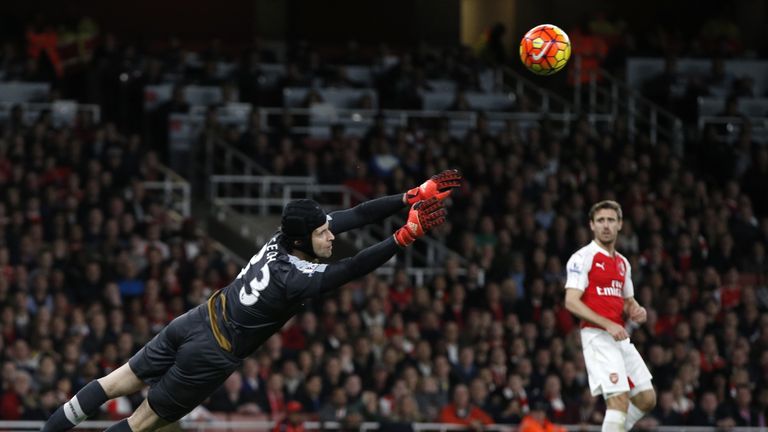 Arsenal goalkeeper Petr Cech saves a shot by Tottenham Hotspur midfielder Christian Eriksen (not in picture)