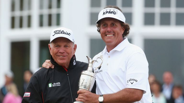 Mickelson holds the Claret Jug with coach Butch Harmon after winning the 142nd Open Championship