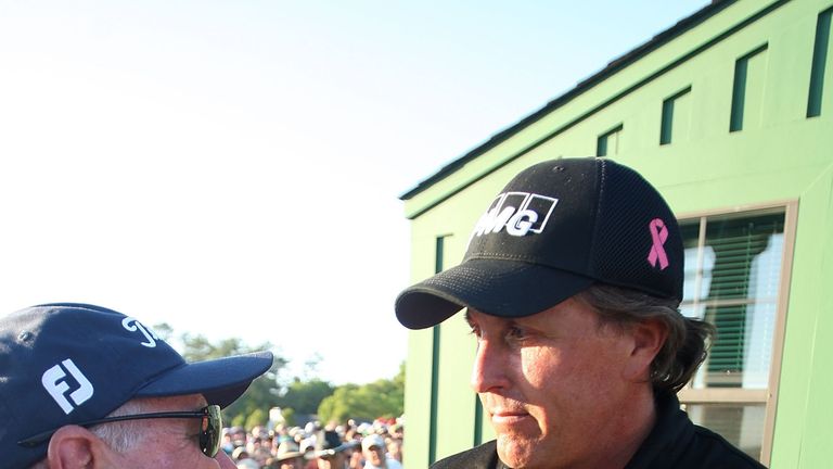 Phil Mickelson is congratulated by Butch Harmon after winning the 2010 Masters