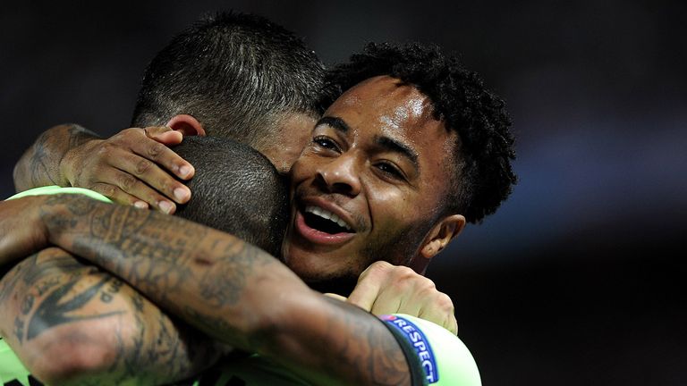 Raheem Sterling celebrates with team-mates after scoring  for Man City